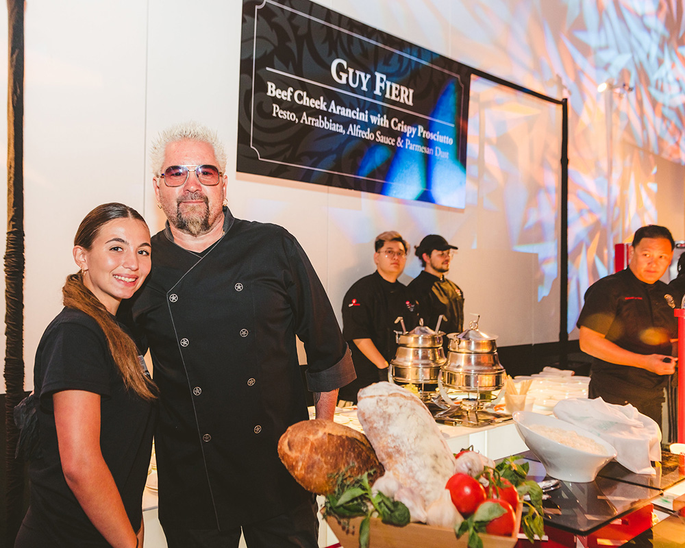 Chef poses with students