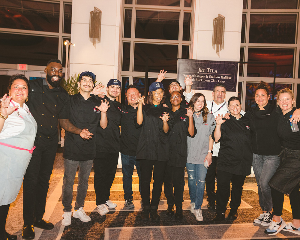 Students with staff posing for photo